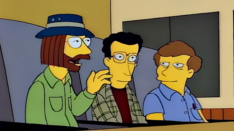 The Simpsons, the Itchy and Scratchy Show writers' room, the writer on the left (wearing glasses and blue hat) voices an objection