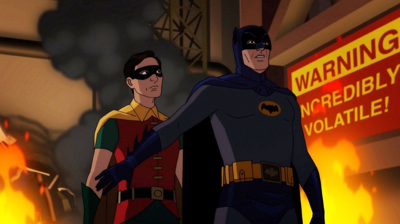 Robin and Batman in an exploding factory in Batman vs. Two-Face