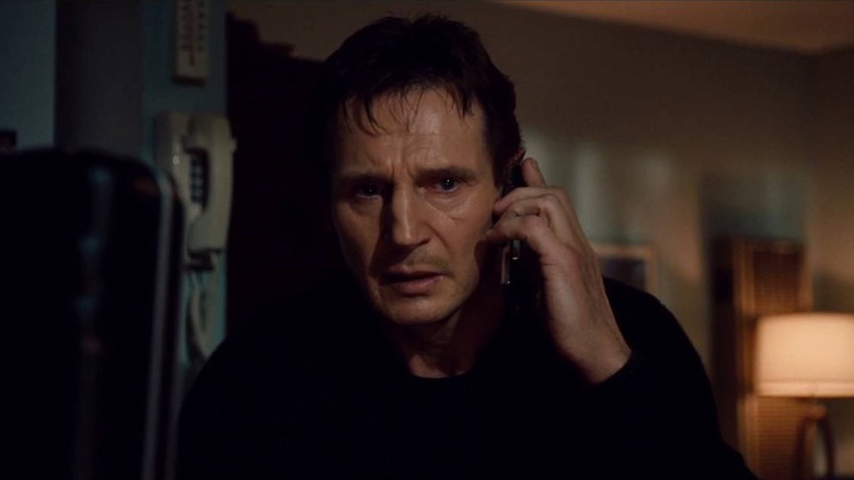 Liam Neeson as Bryan Mills on the phone in Taken