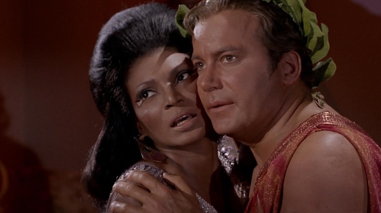 Uhura and Kirk, forced to canoodle against their will on Star Trek