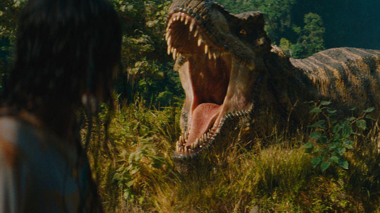Luna Blaise as Teresa Delgado encountering a fearsome T-rex in Jurassic World Rebirth