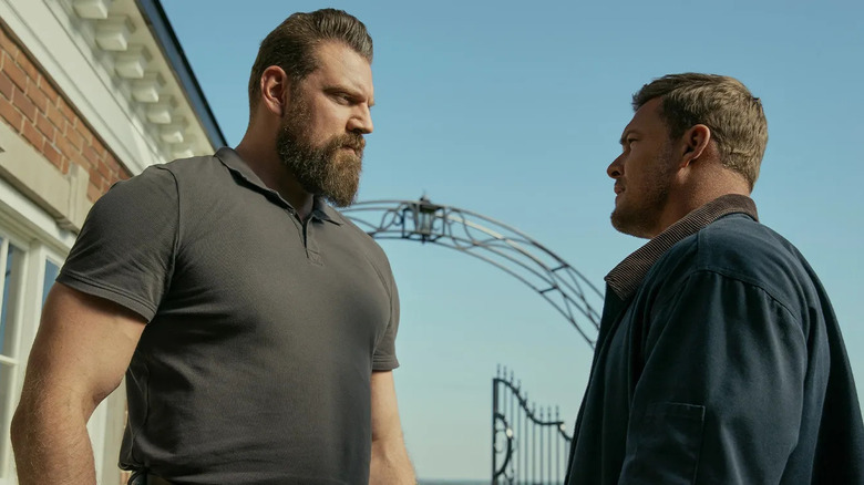 Jack Reacher faces off against Paulie outside the guard house in Reacher season 3