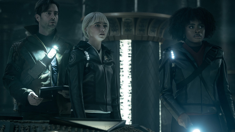 Korby, Nurse Chapel, and Uhura in an ancient temple, scared, on Star Trek: Strange New Worlds